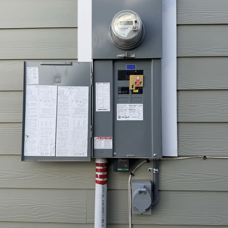 Full outdoor panel with meter and generator inlet on siding